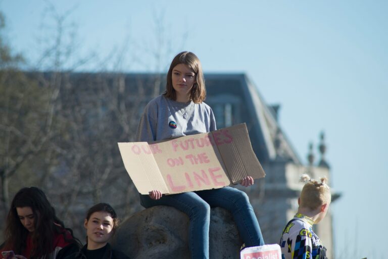 Woman holding cardboard signage